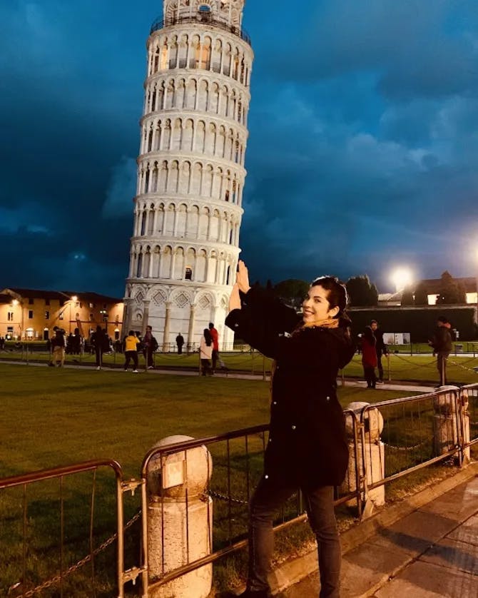 Posing for a picture with the Leaning Tower of Pisa