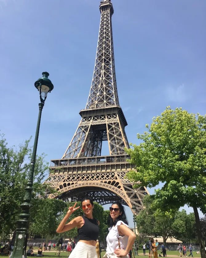 Posing for a picture with the Eiffel Tower