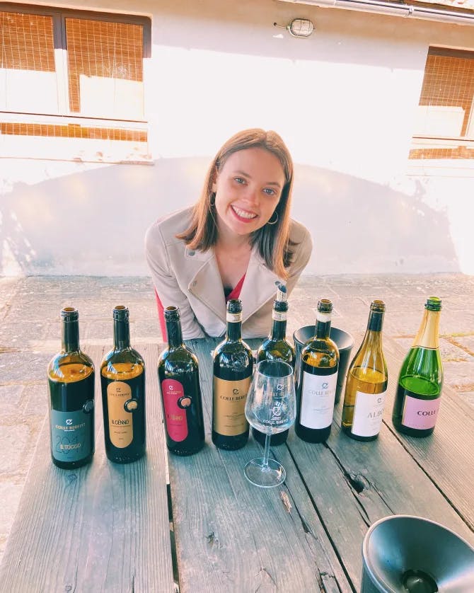 Beautiful woman with multiple wines bottles