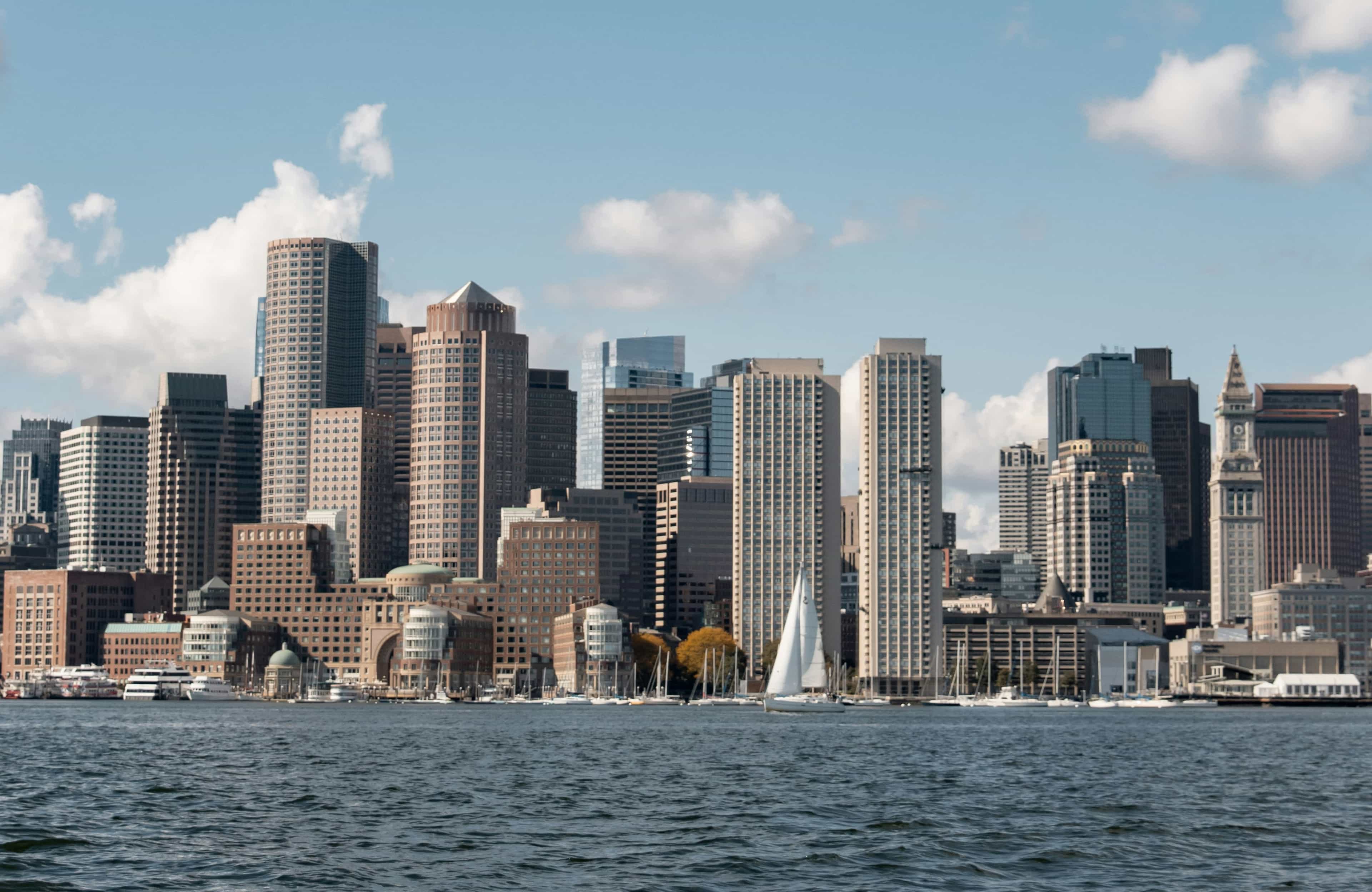 Skyscrapers lining a harbor during day