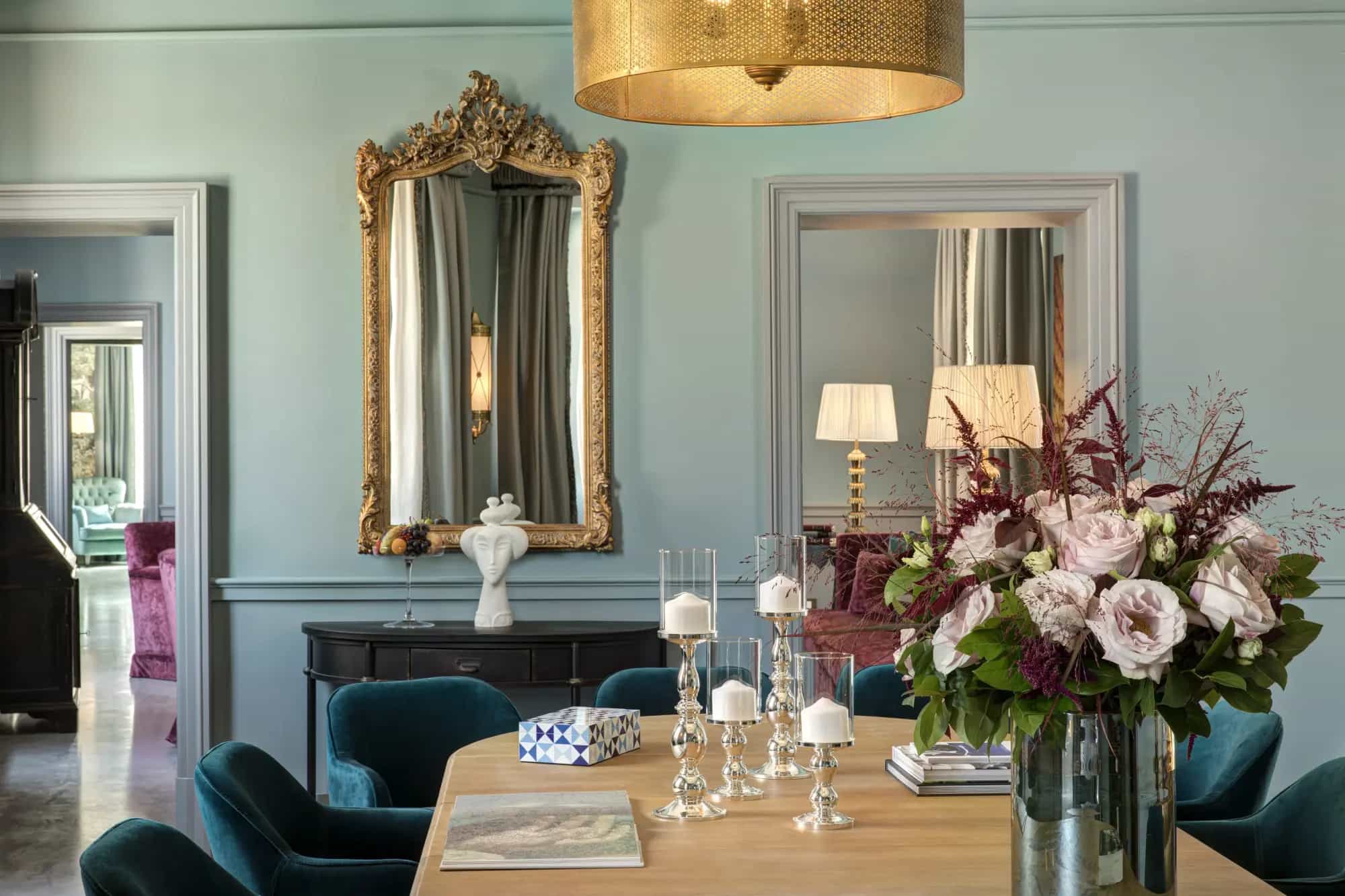 a beautiful bouquet of flowers on a big dining room table