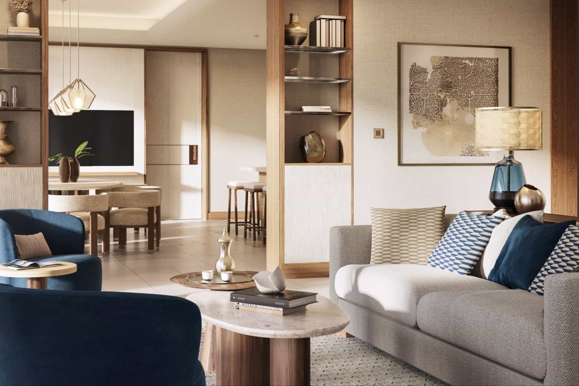 a spacious Middle Eastern living room with blue plush chairs and a gray couch