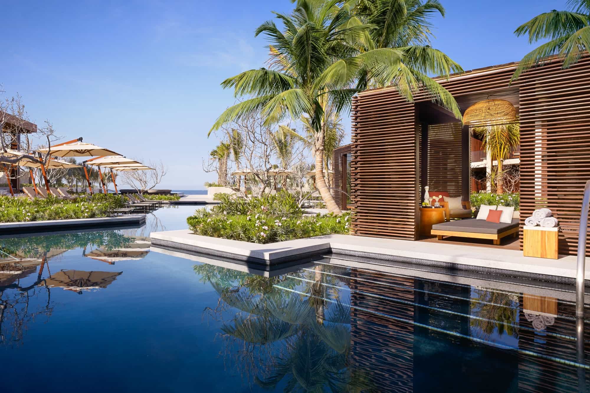 a modern pool cabana on a luxe oceanfront pool