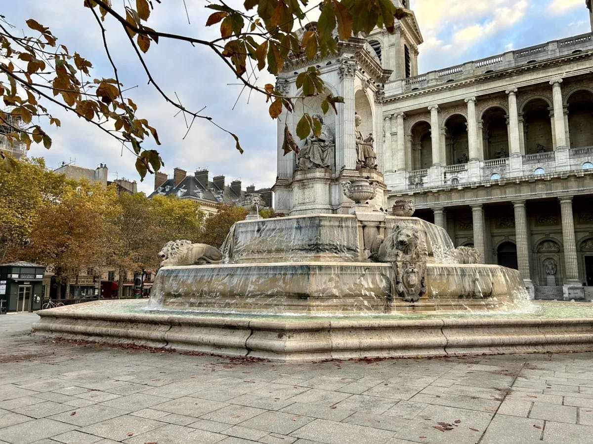 A fountain in the 6th arrondissement of Paris with statues.