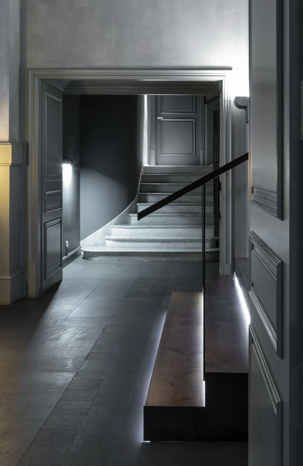 a dimly lit gray entryway