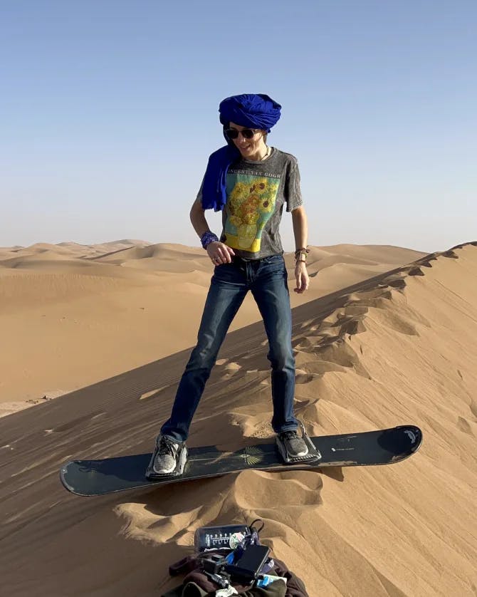 Travel advisor posing in a desert