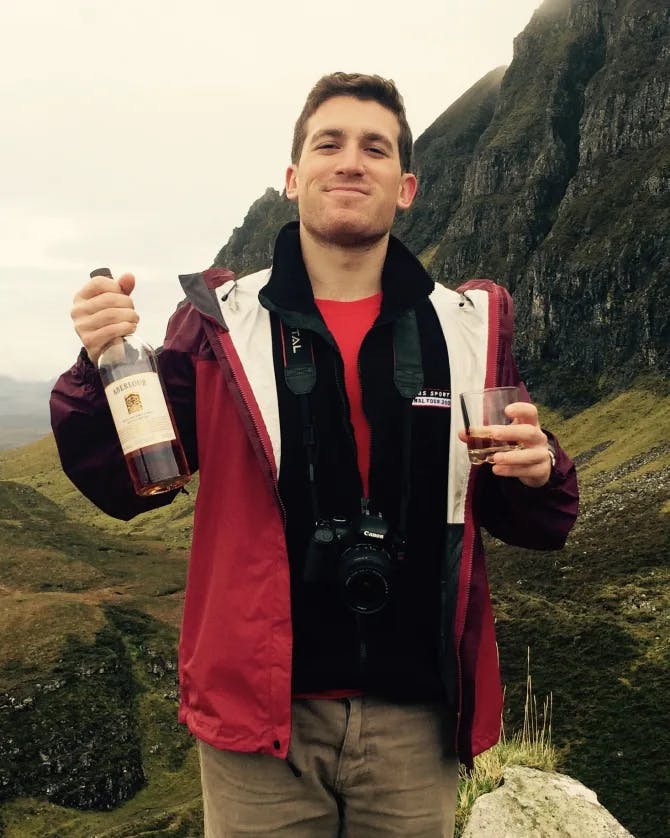 Boy with the wine in the nature