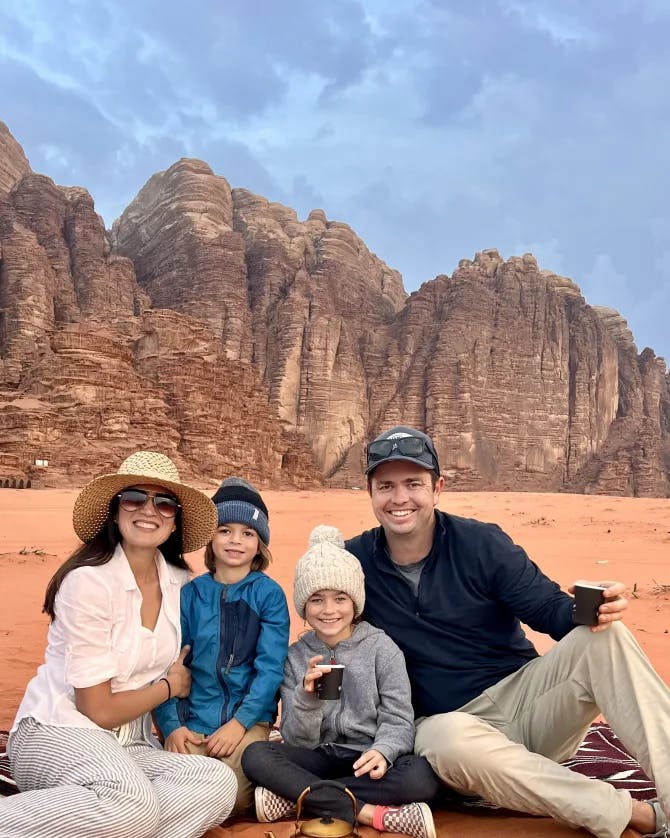 Nadiah posing with her family and the desert in the background. 