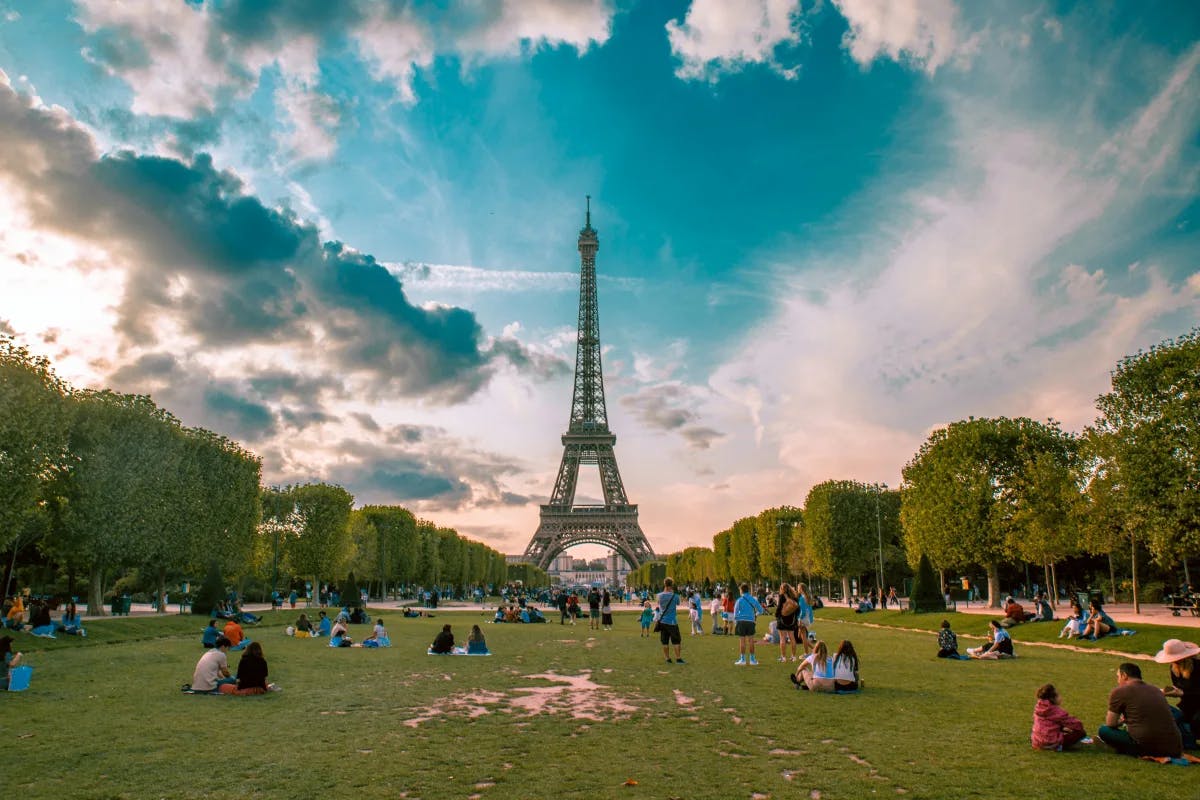 A lawn in front of the iconic Eiffel Tower in Paris during the daytime