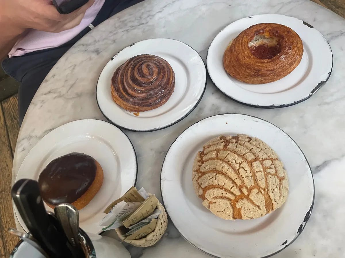 A picture of different kinds of dessert served on a table.
