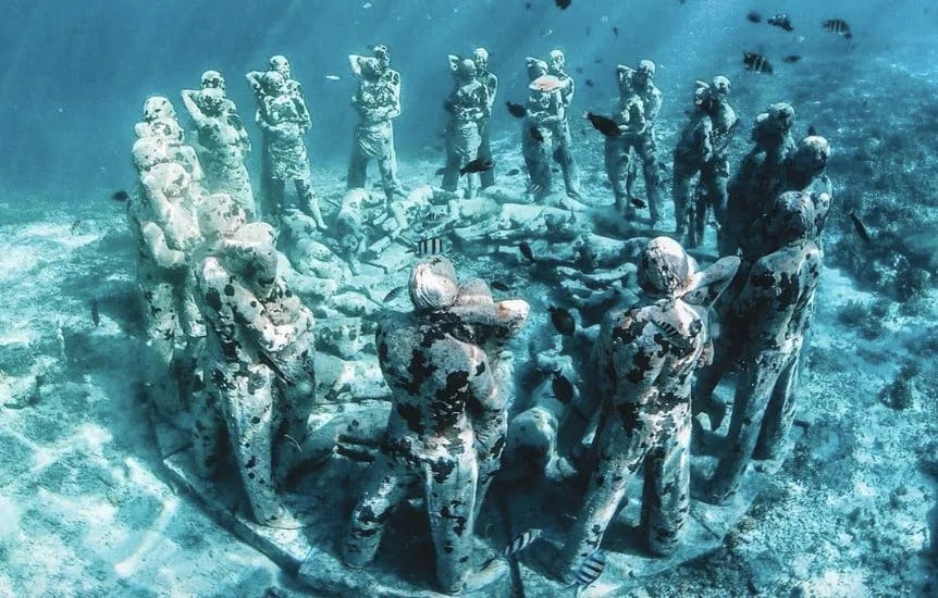 This image depicts underwater ruins in the form of human figures. 