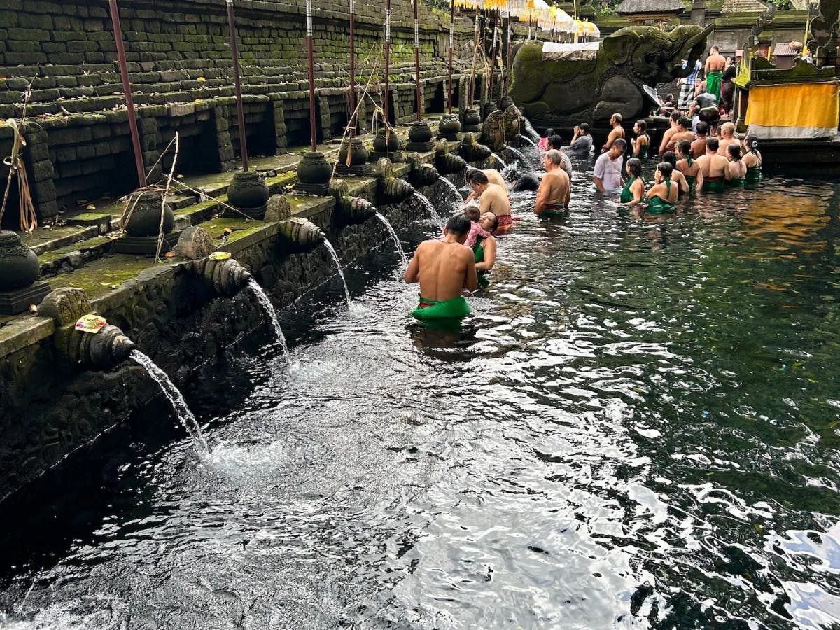 People bathing in a water body. 