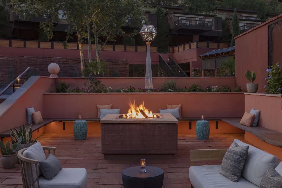 An outdoor seating area with a fire place