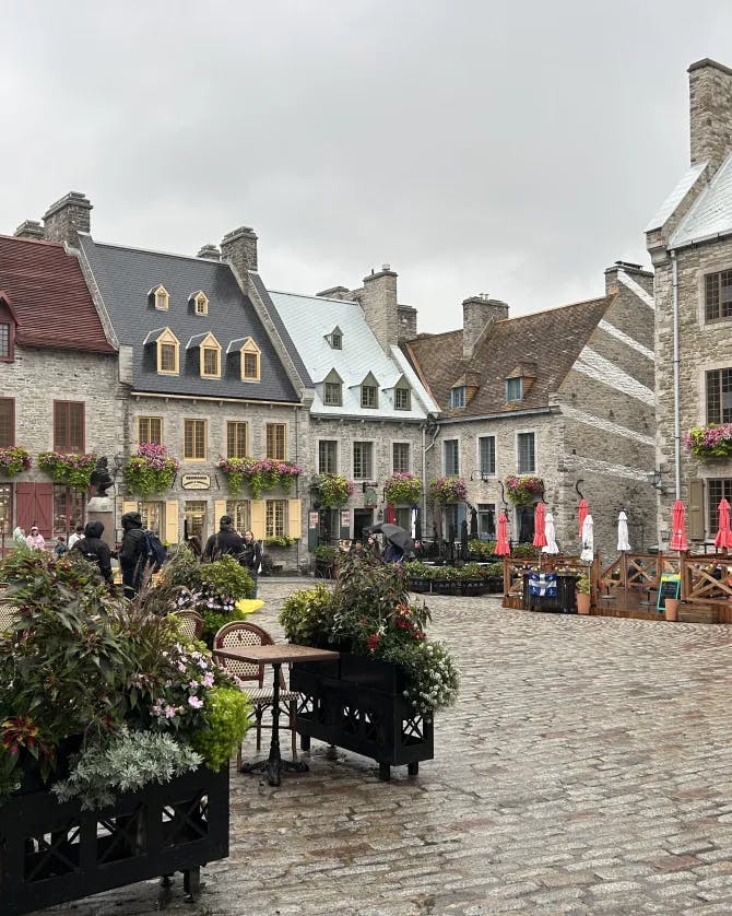Beautiful view of Place Royale with old stone buildings with storefronts and cobbled street