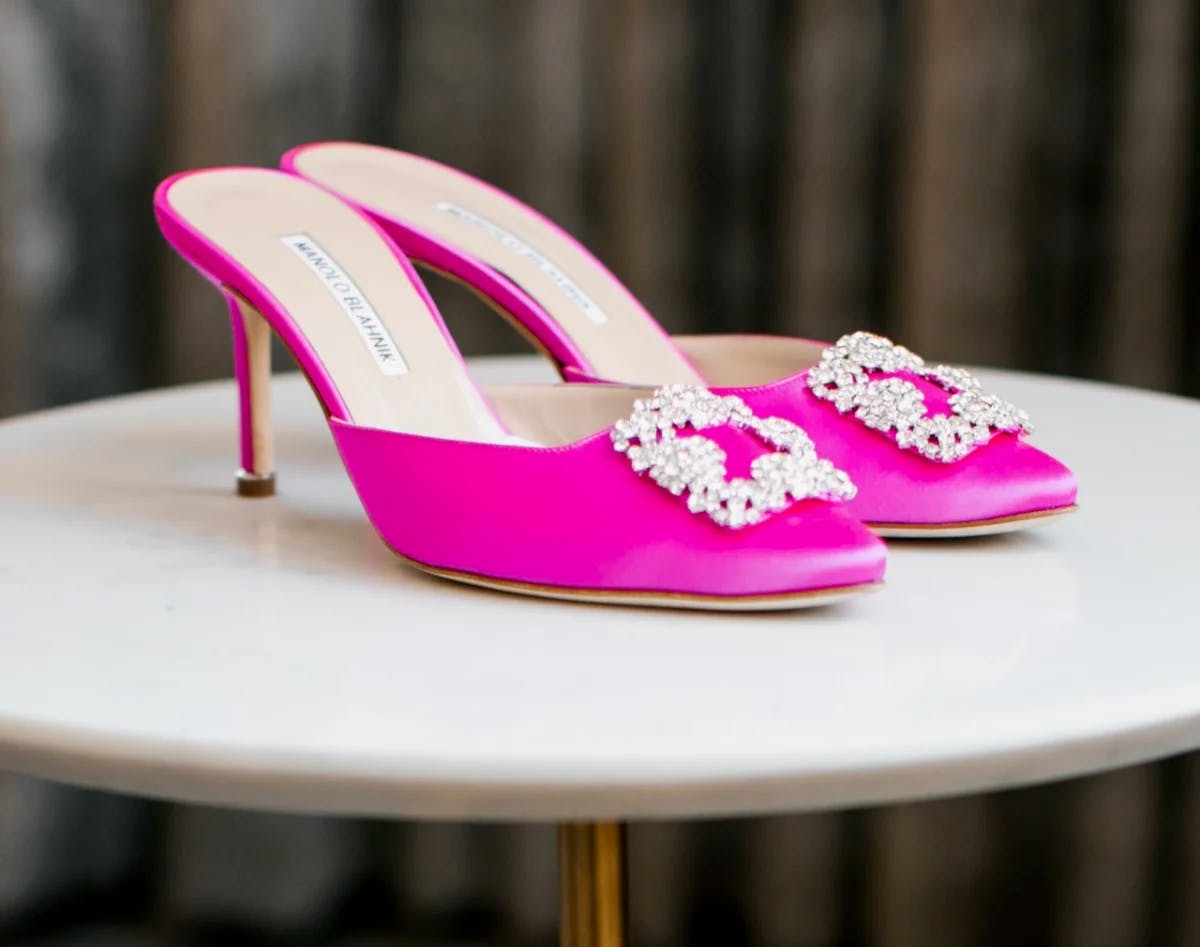 A pair of pink heeled shoes