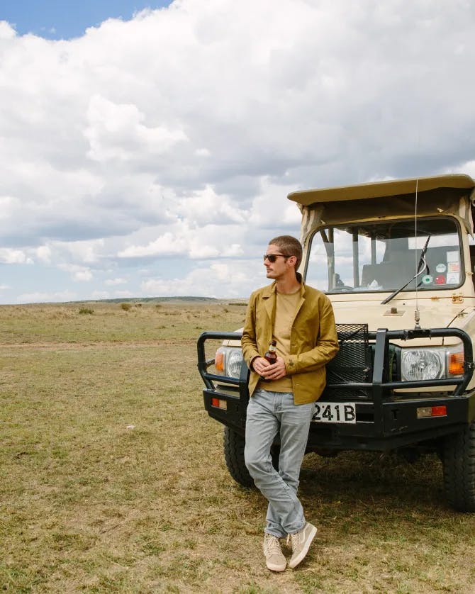 Scott posing with a jeep