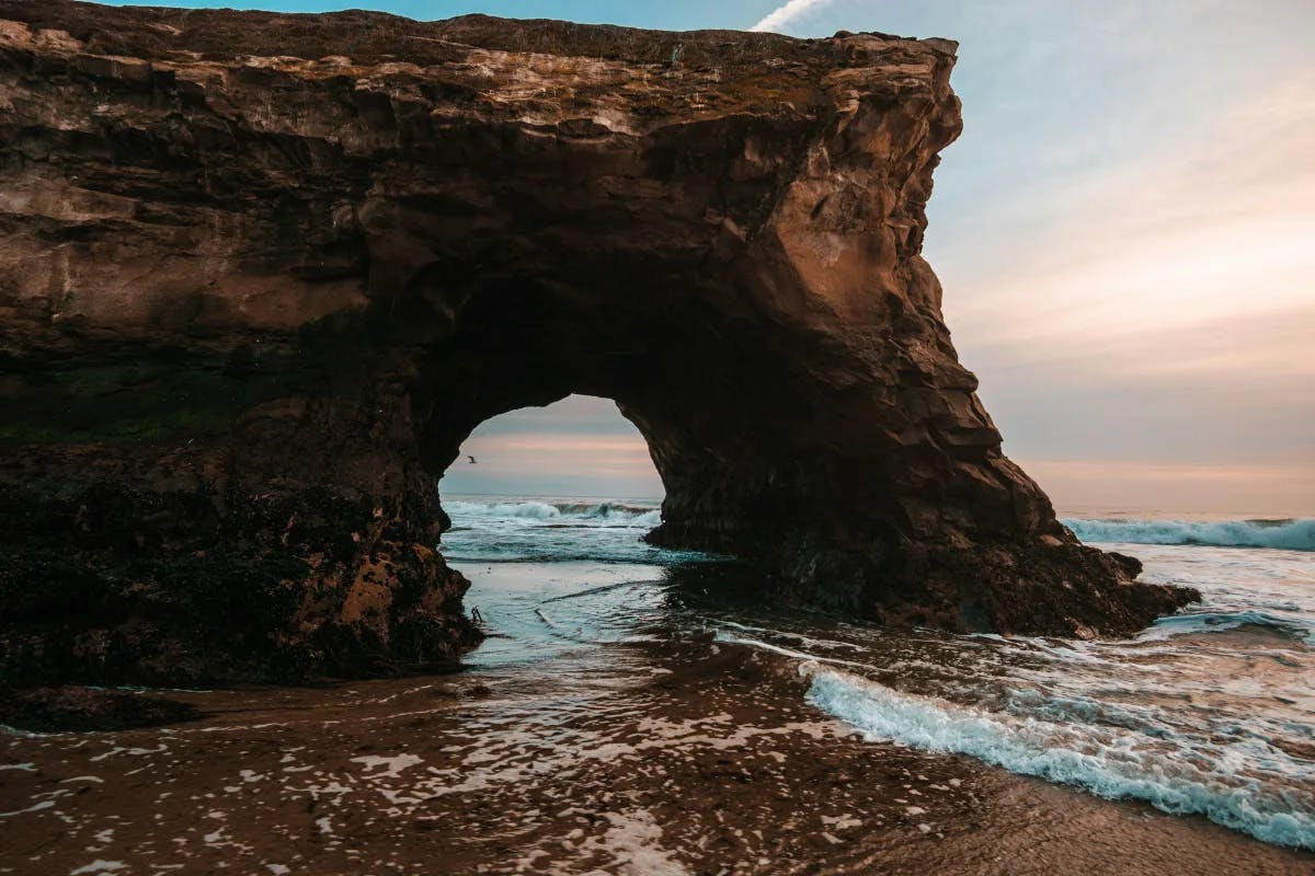 An arch rock formation at Natural Bridges State Beach.