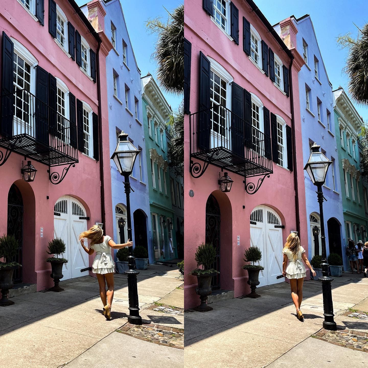 Advisor posing for a picture in a white dress next to a light post with colorful houses in the background. 