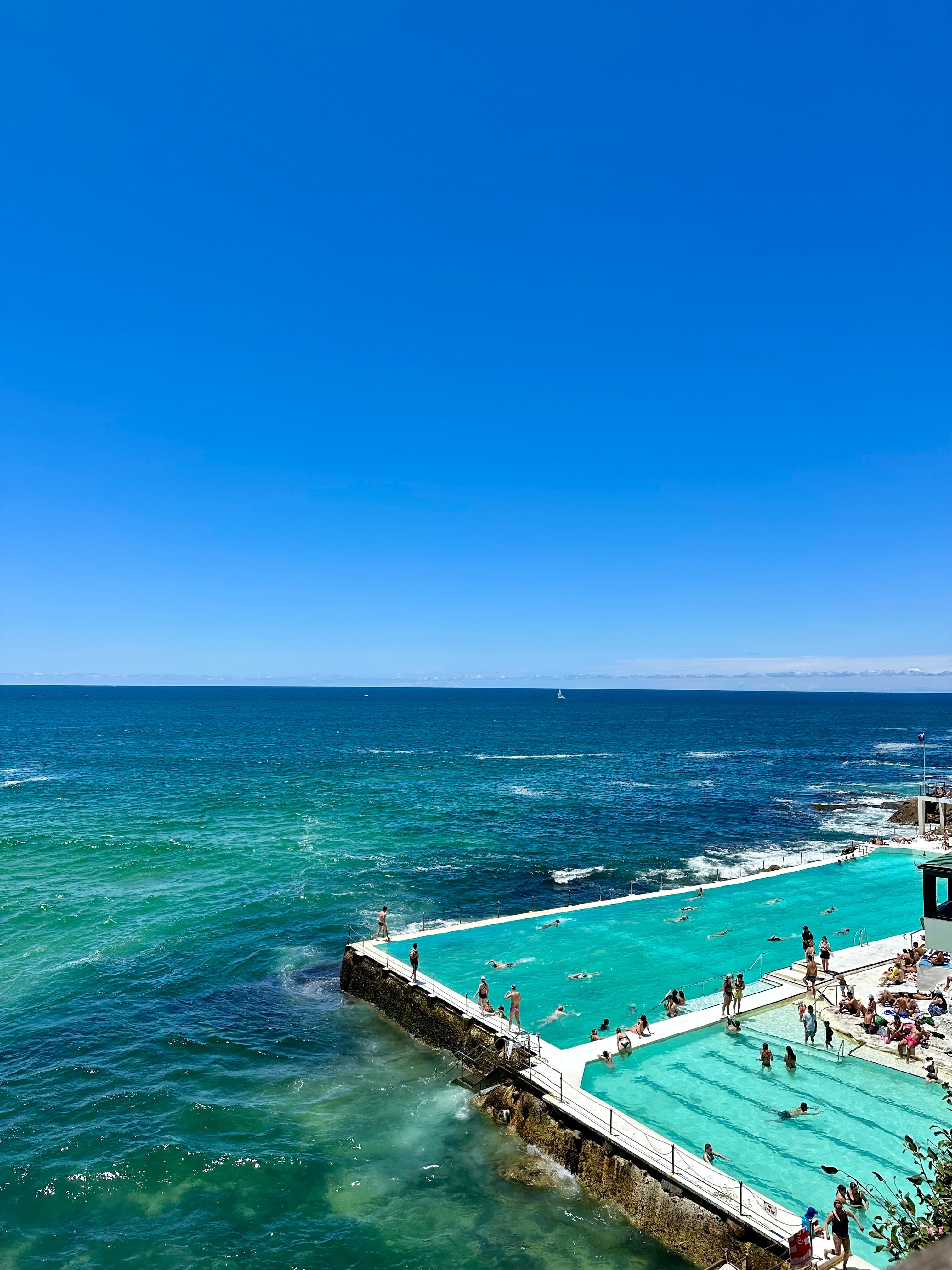 View of the Bondi Beach infinity pool on a sunny day in Australia