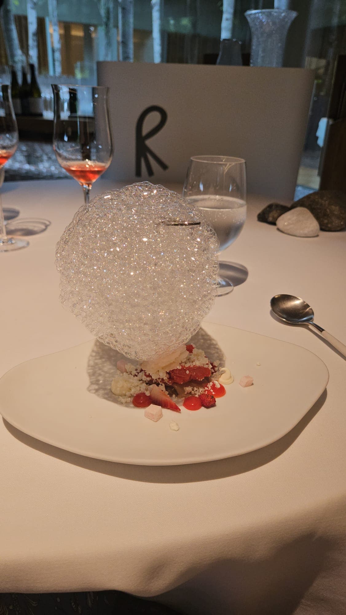 A delicious dessert on a table with a white table cloth.