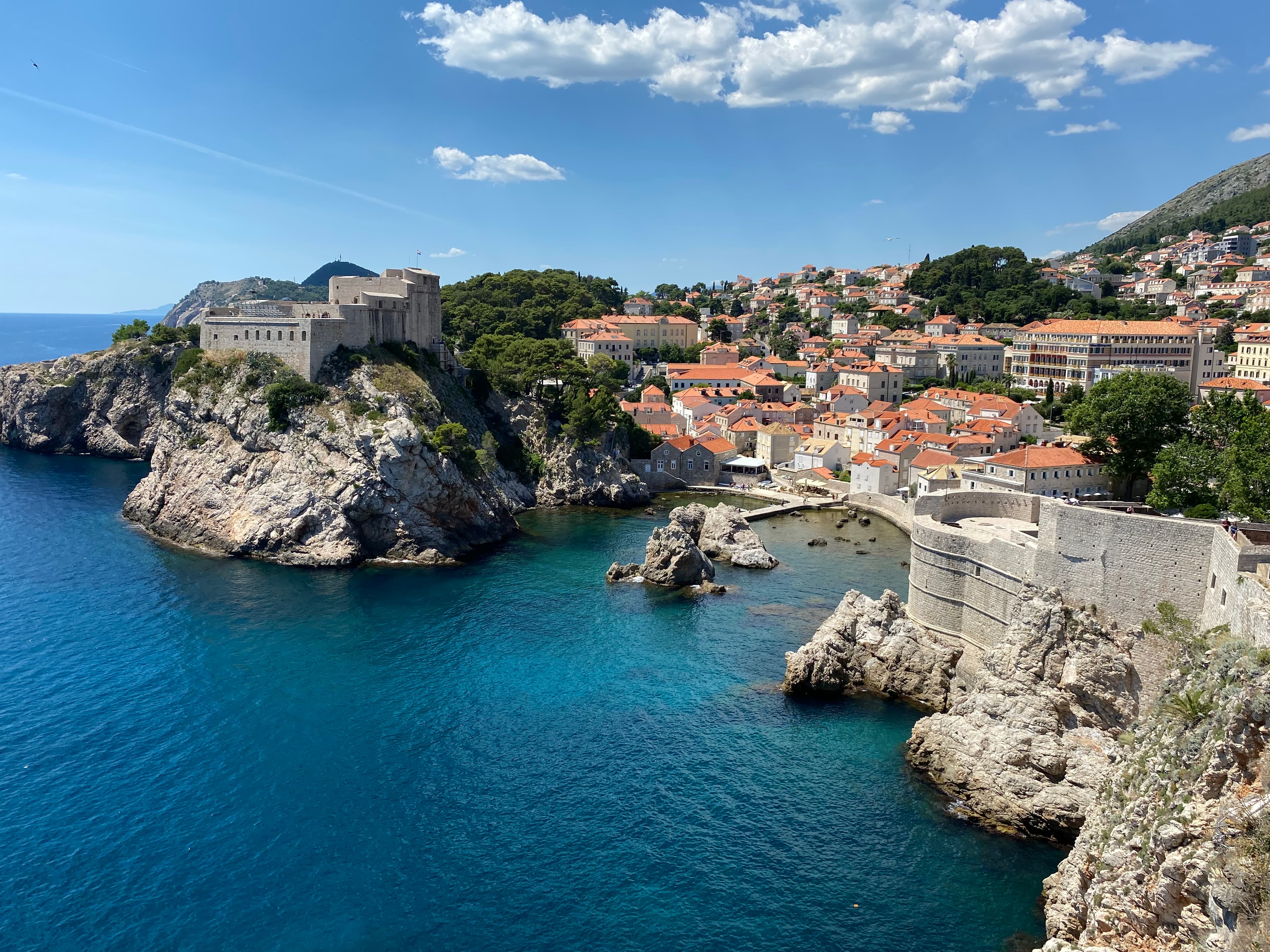 A view of an ocean side town on a sunny day.