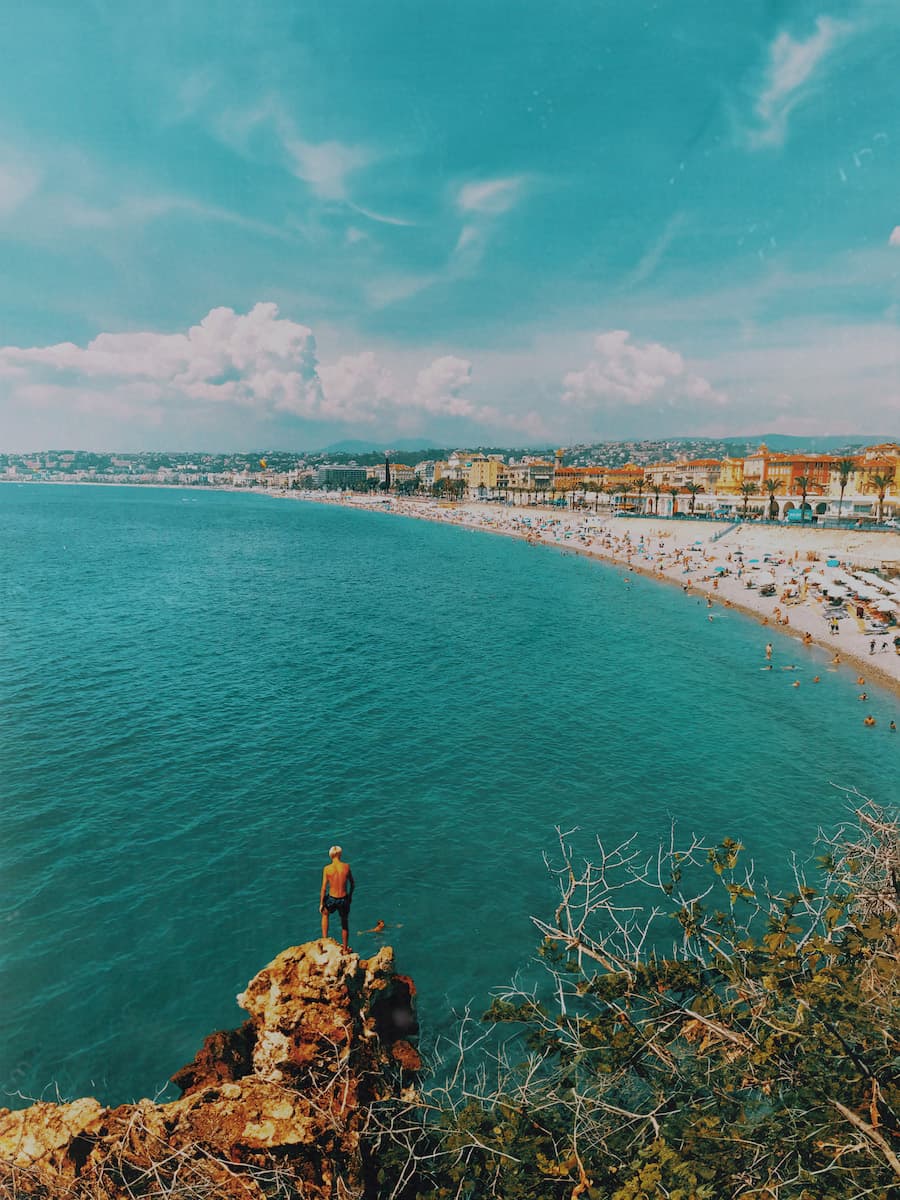 Wide angle view of the ocean and the beach during the daytime.