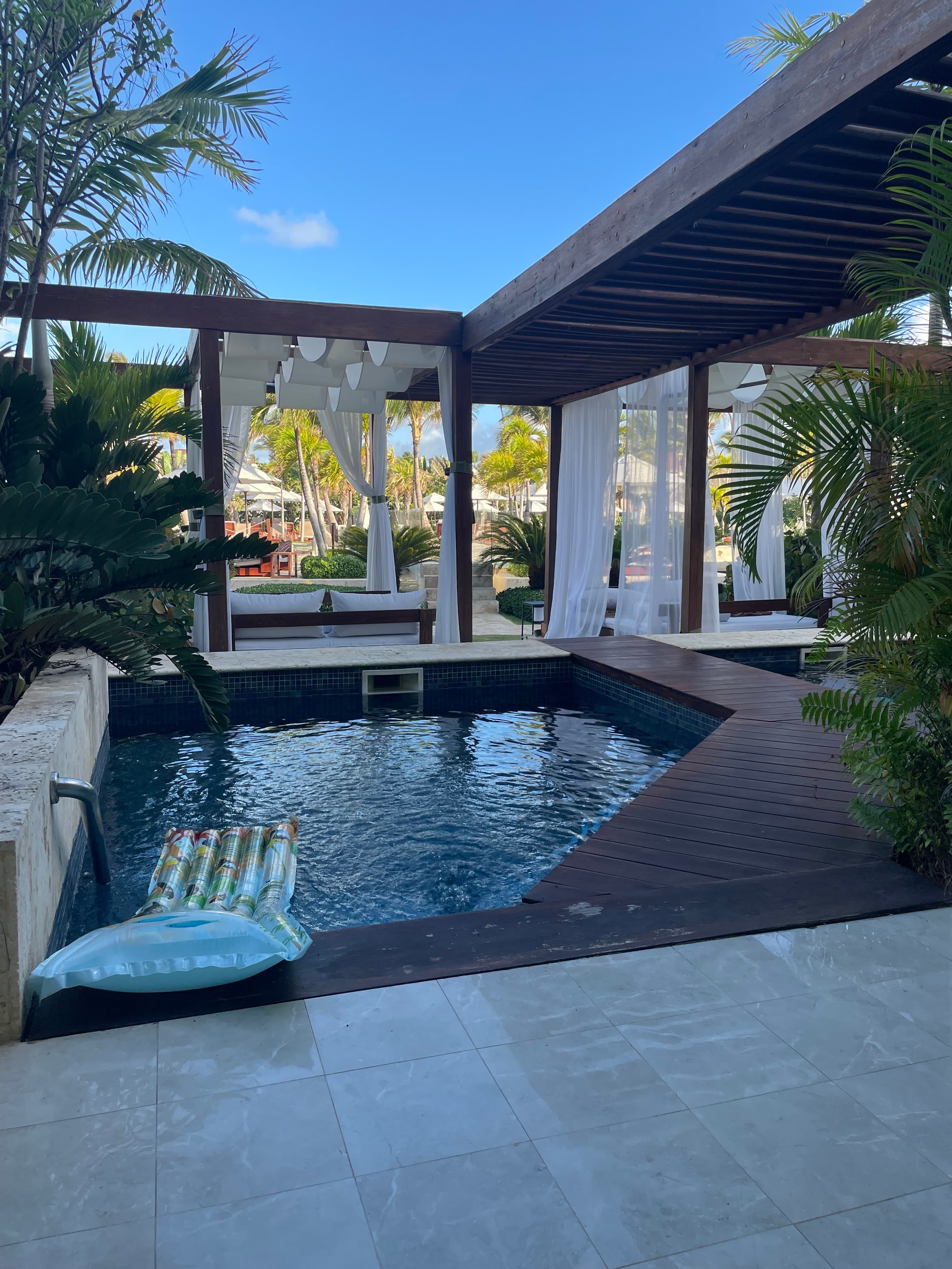 Pool on the patio of a hotel.