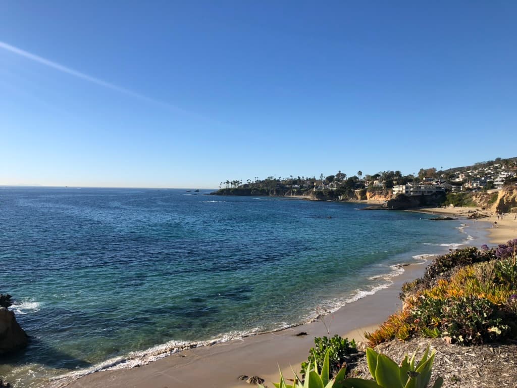 Beautiful view of a Southern California coastline featuring an empty beach and clear skies