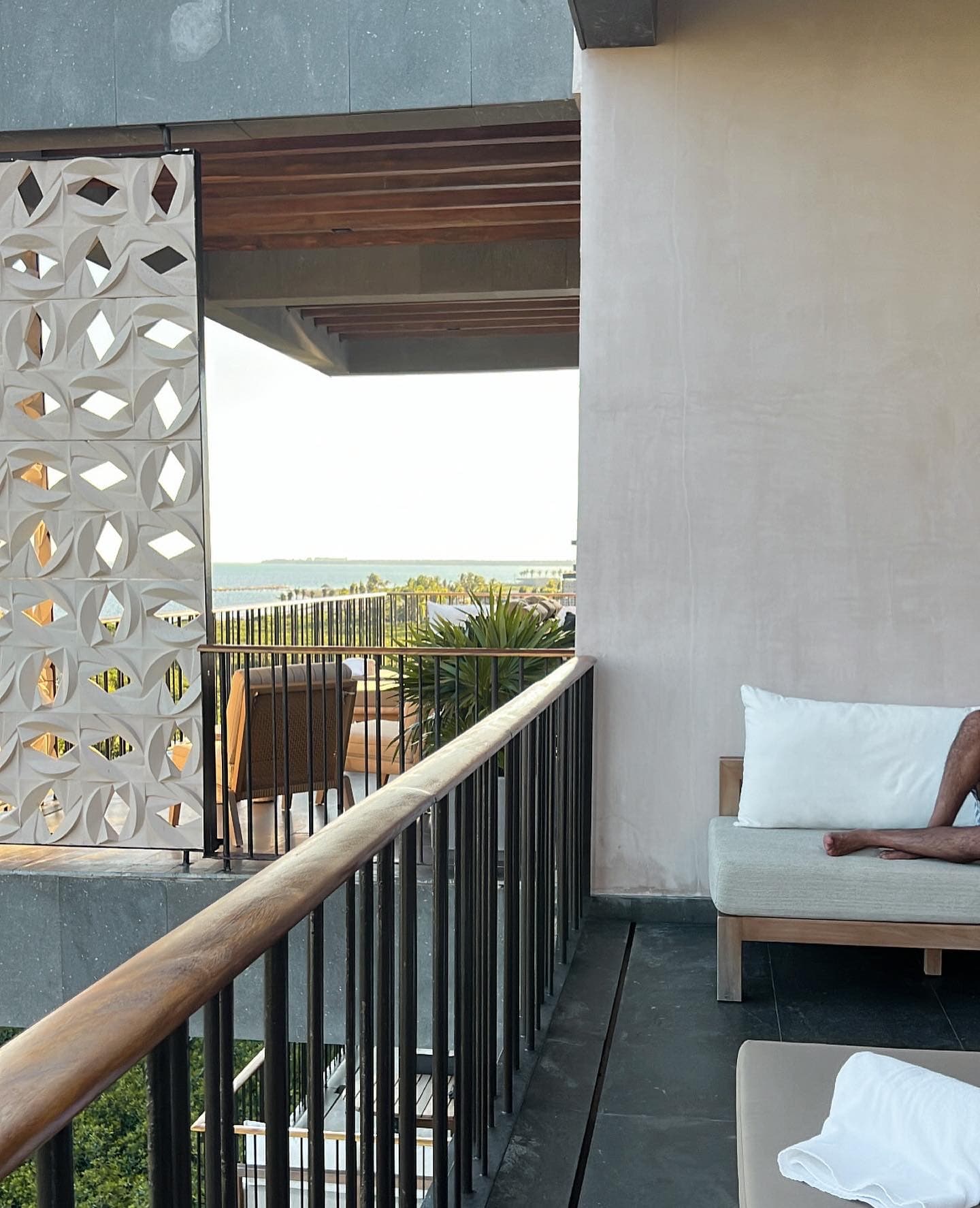 View of a ledge off of a hotel balcony during the daytime.