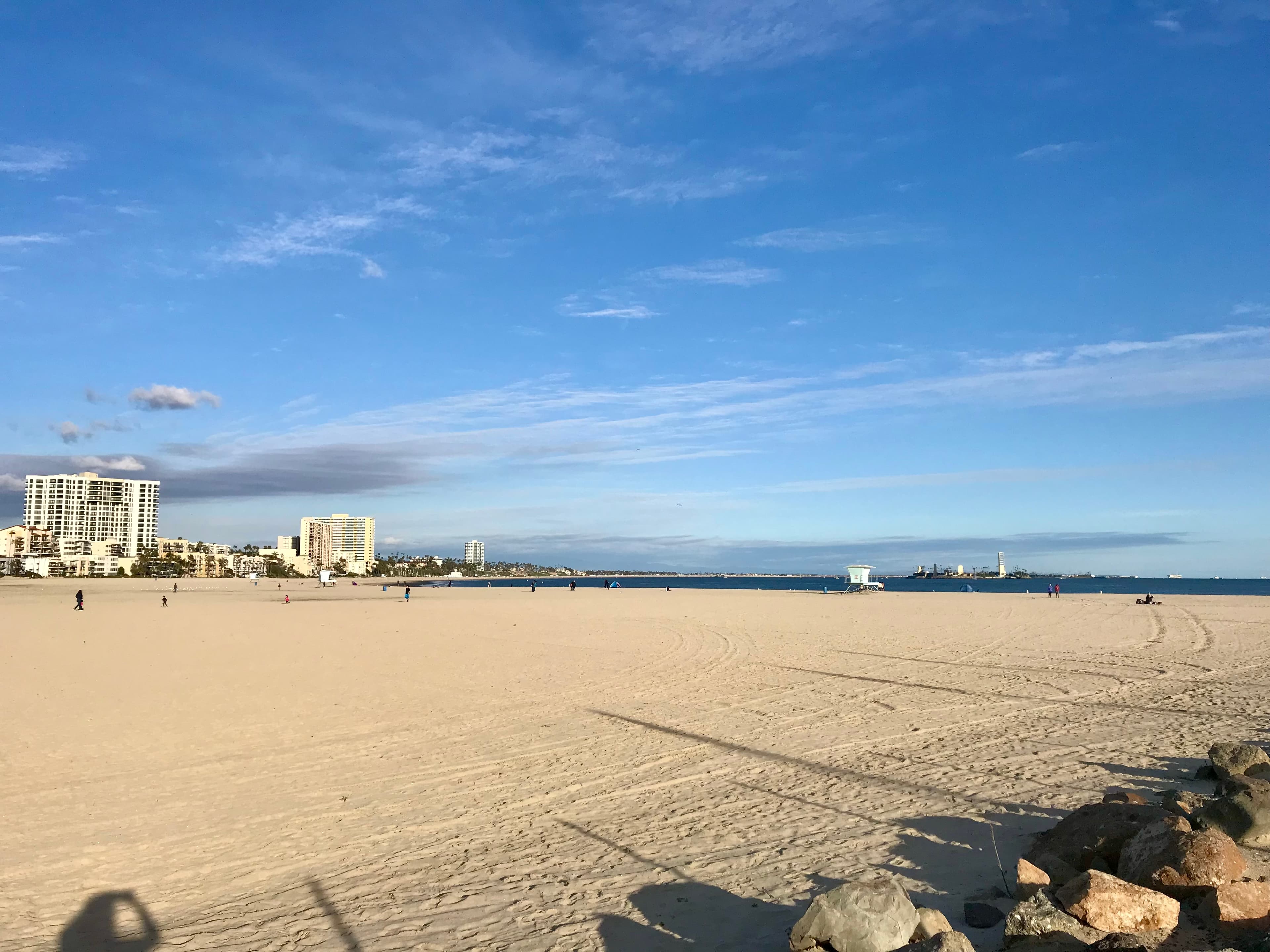 View of an empty wide beach on a sunny day