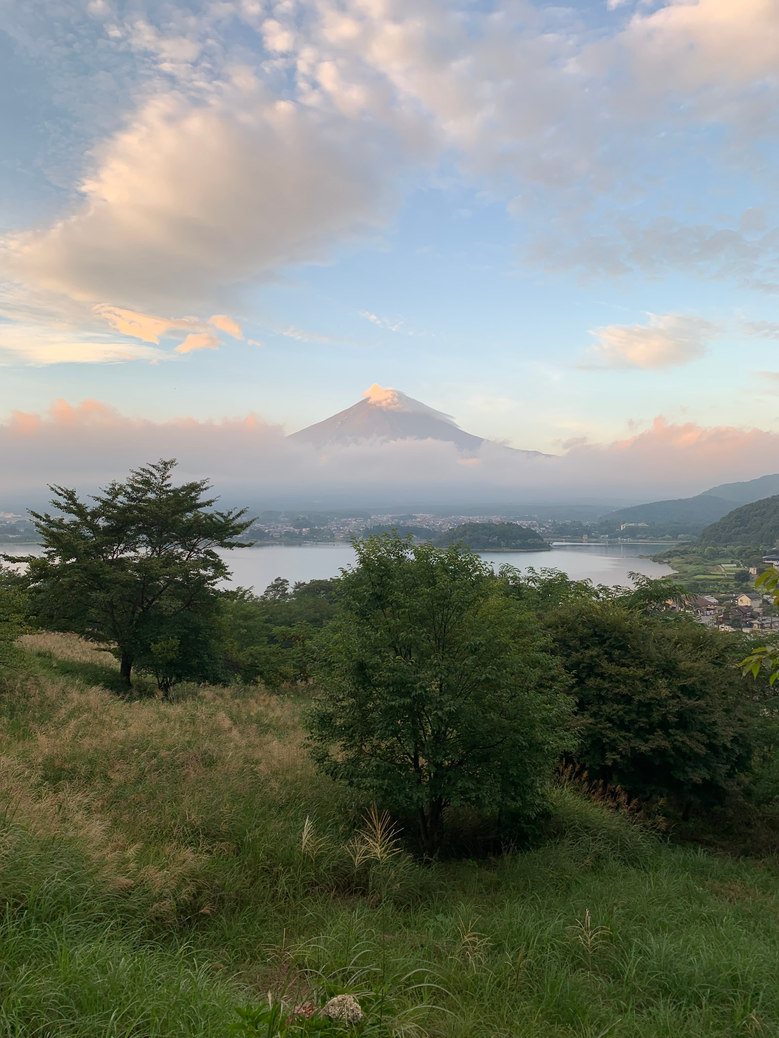 Beautiful view of a lake and distant mountain with clouds overhead