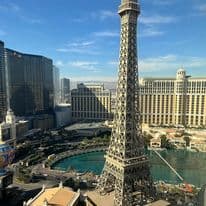 View of the Eiffel Tower replica and surrounding resorts in Las Vegas on a sunny day