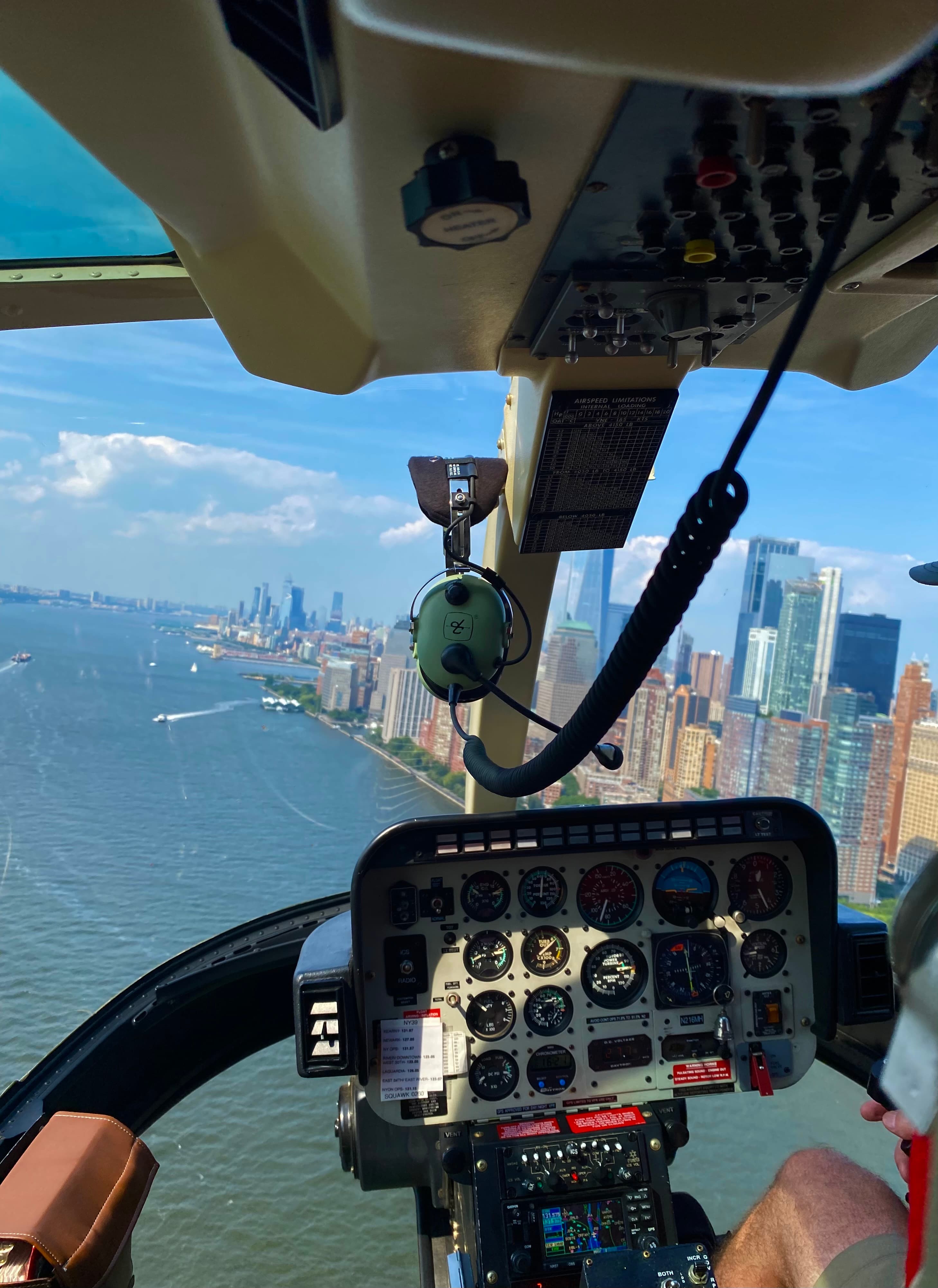 View of a city skyline as seen from above in a helicopter