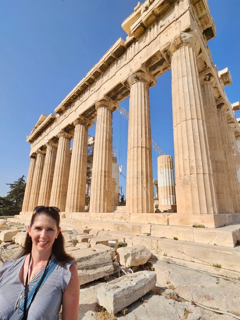 Advisor standing in front of historical white stone pillars.