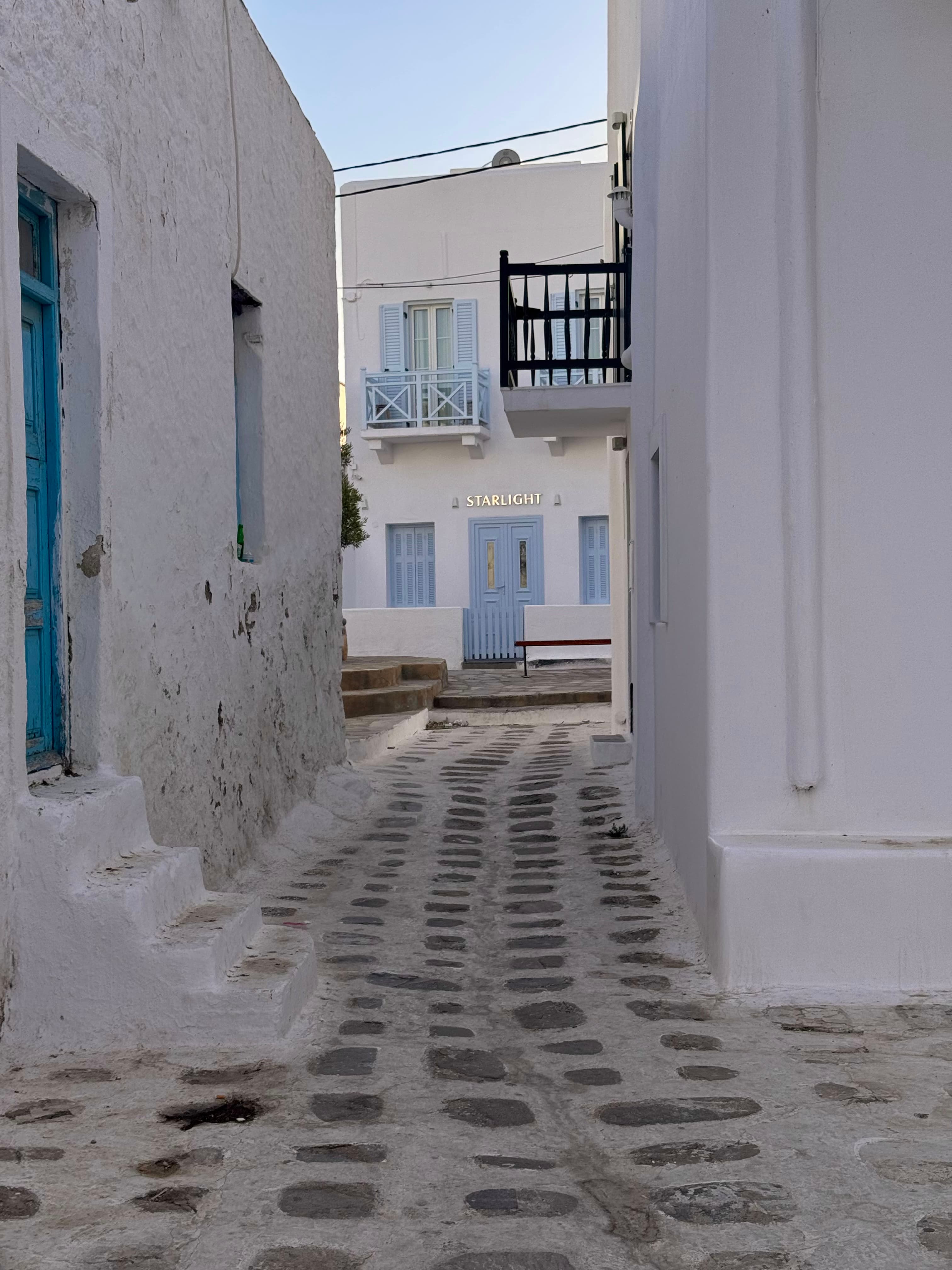 A view of white building in the daytime.