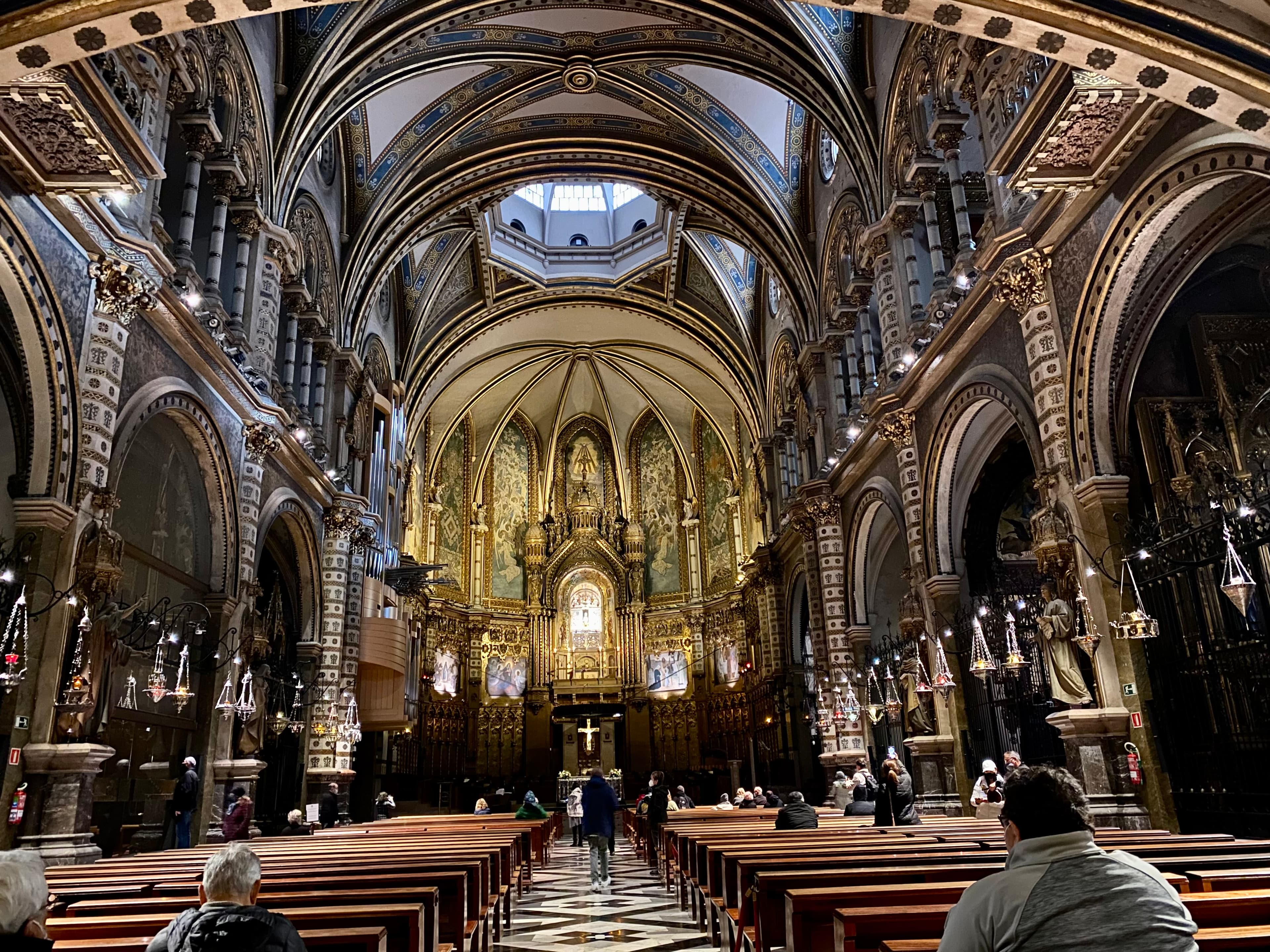 The inside of a church with an ornate interior. 
