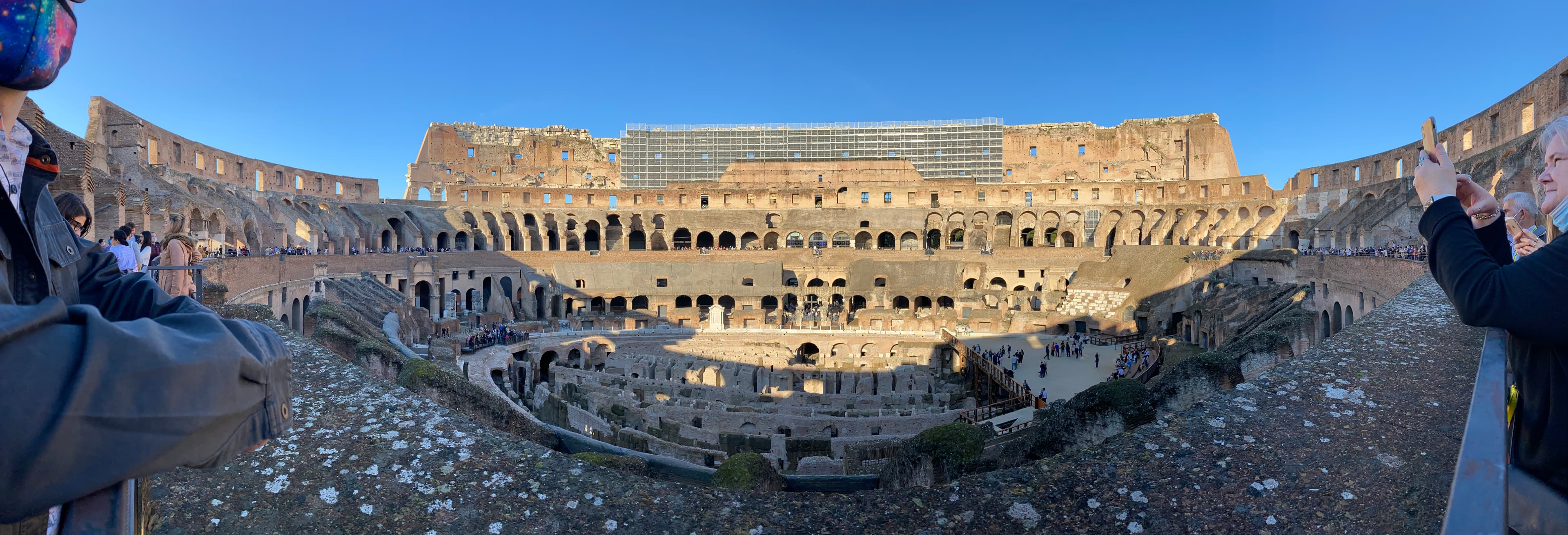 Image of ancient colosseum during the day.