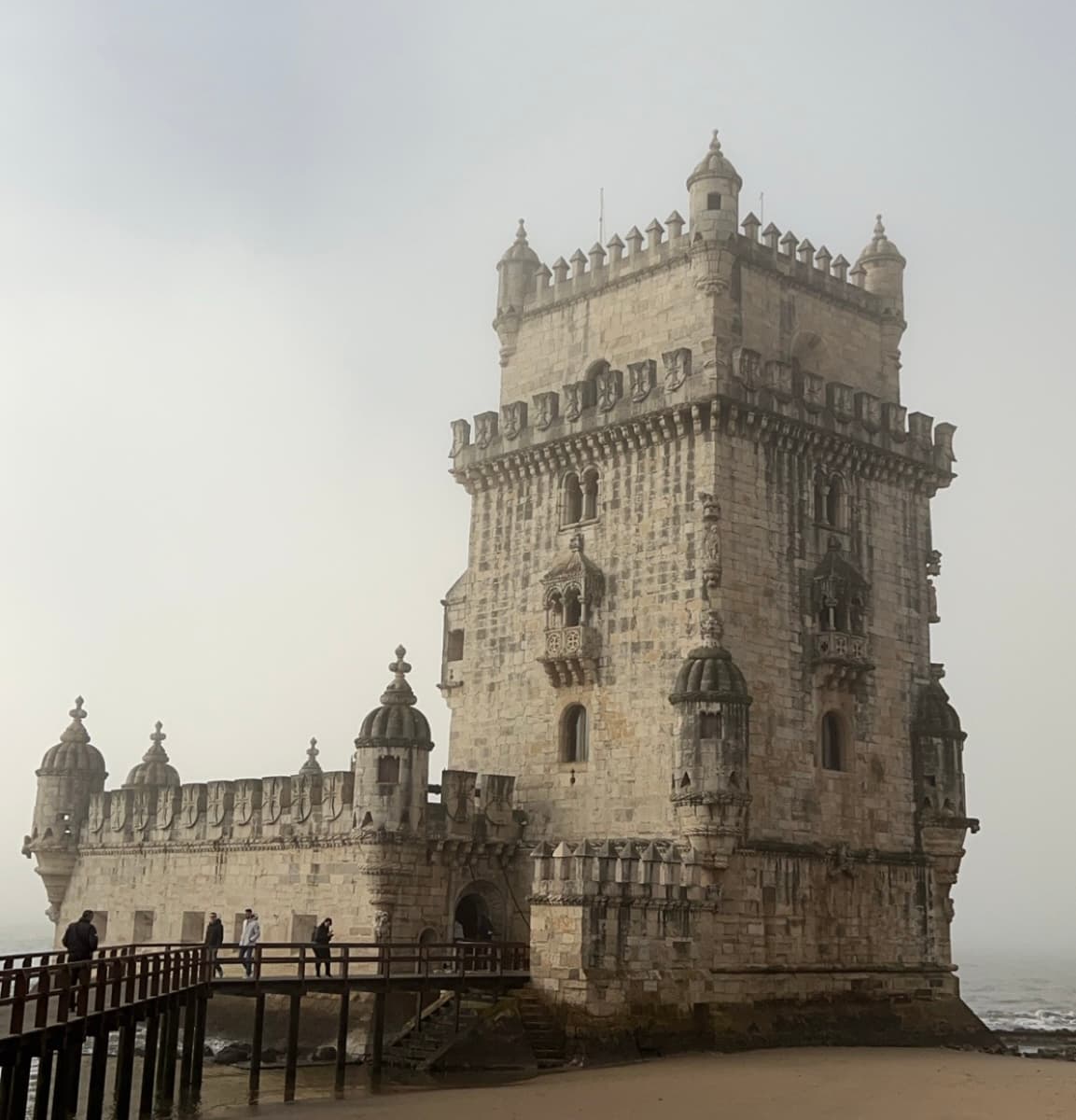 View of a beautiful old castle tower under cloudy skies
