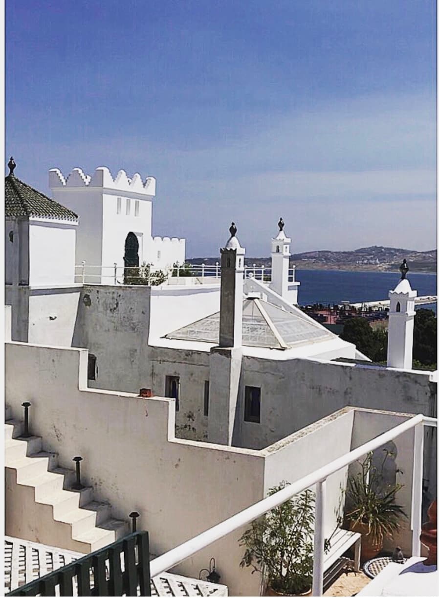 View of white buildings overlooking the sea on a sunny day