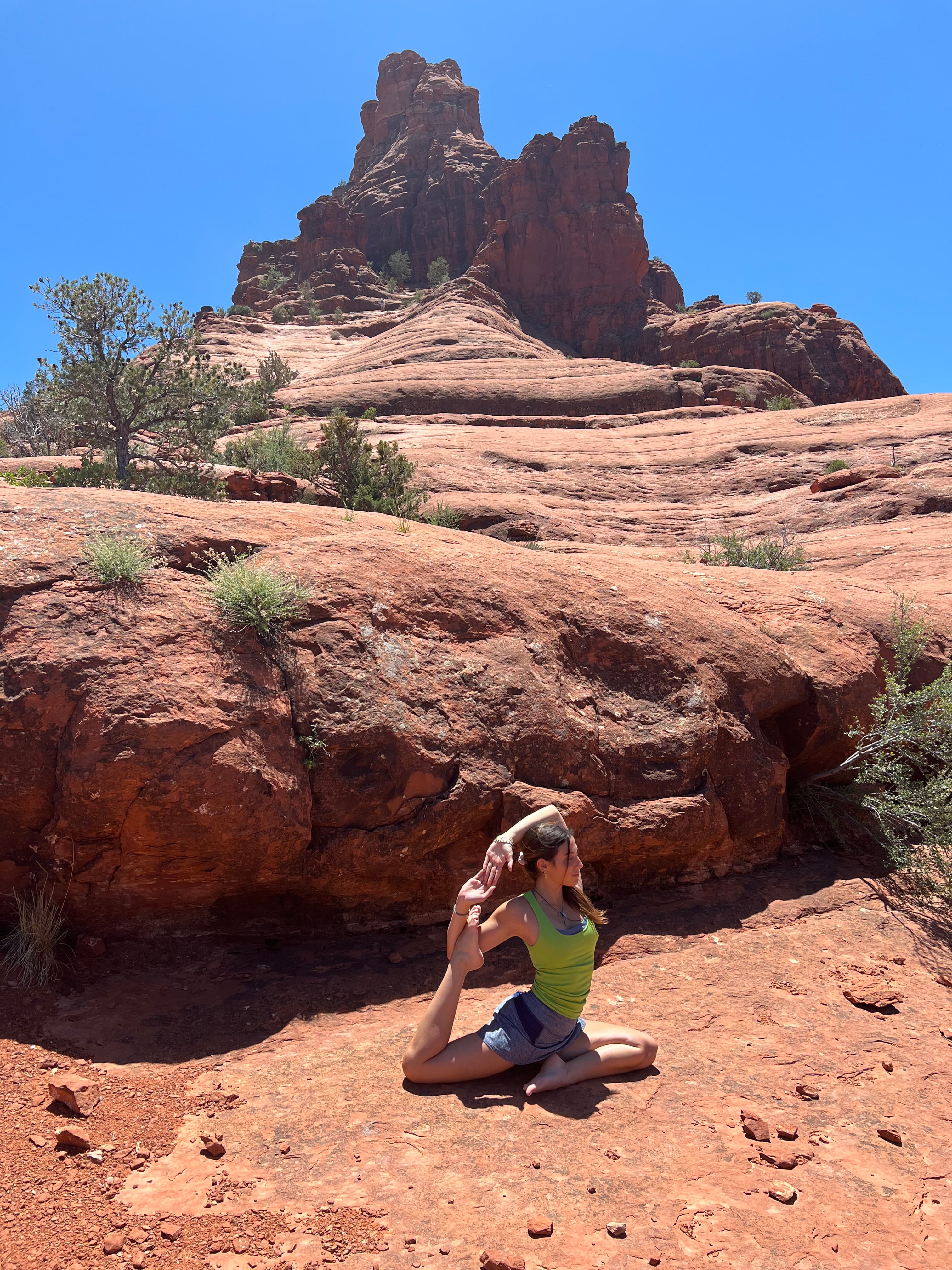 Advisor stretching on top of a canyon.