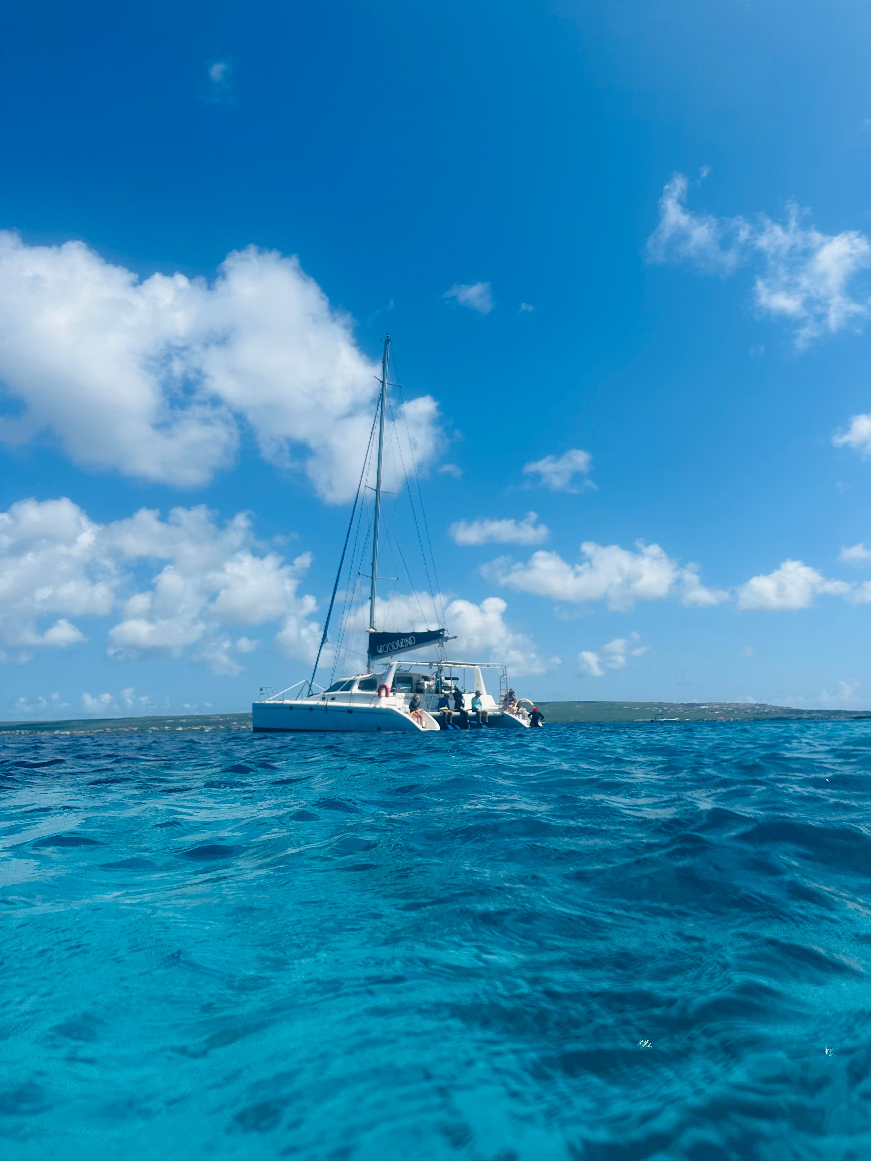 Boat over a clear blue ocean.