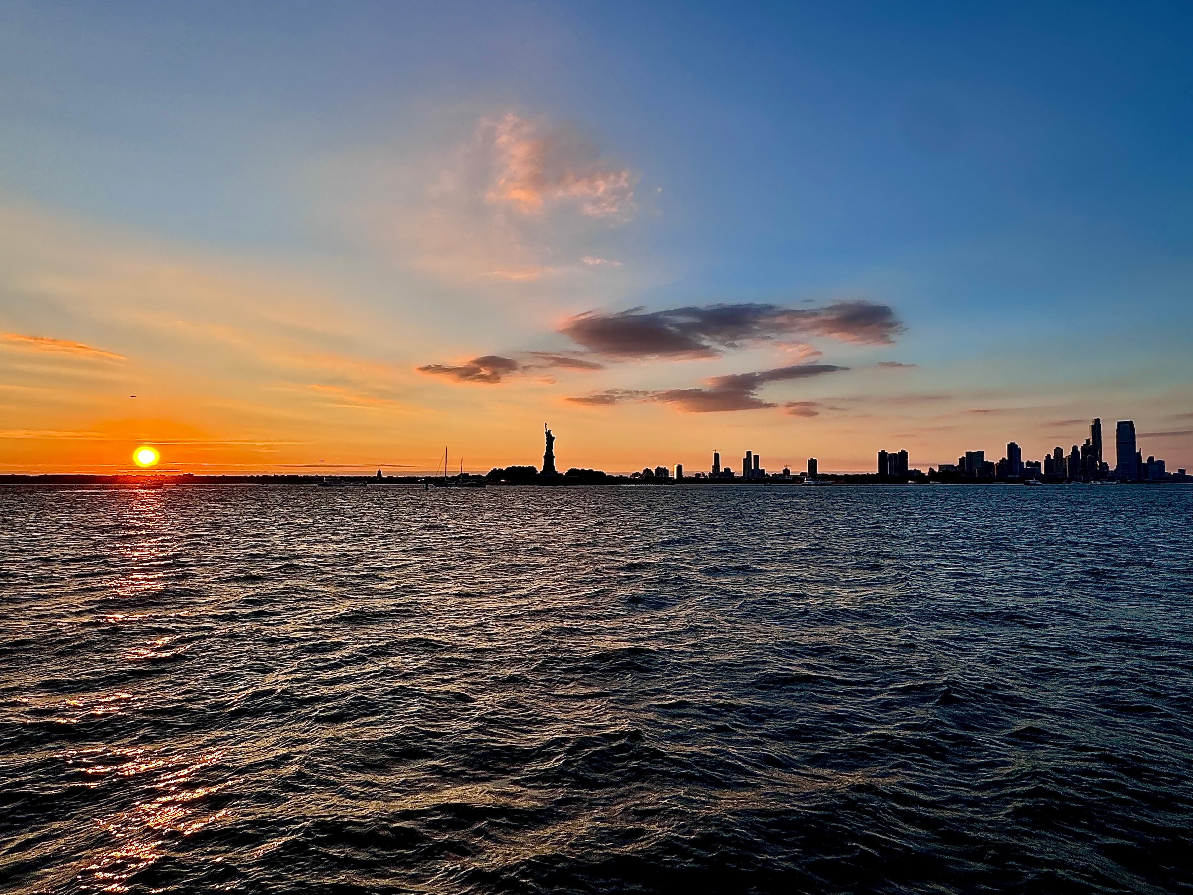 Beautiful view of the New York City skyline at sunset as seen from the water