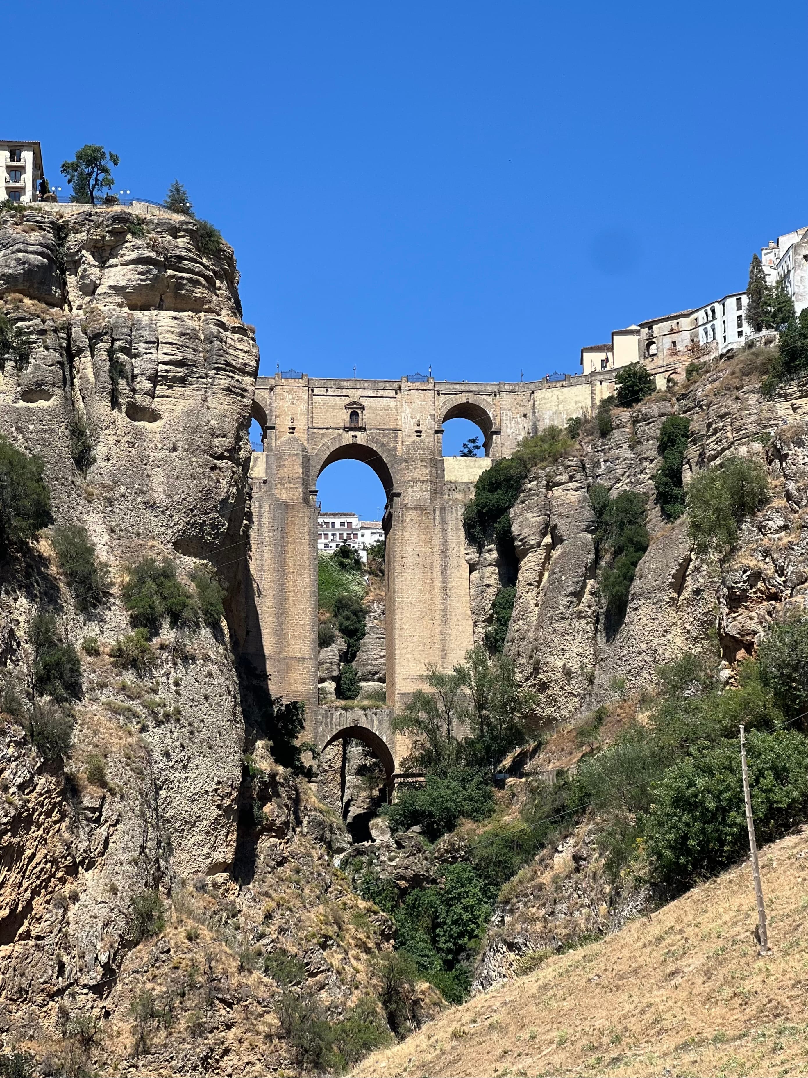 Ruins near a bridge on a rocky crevice on a sunny day. 