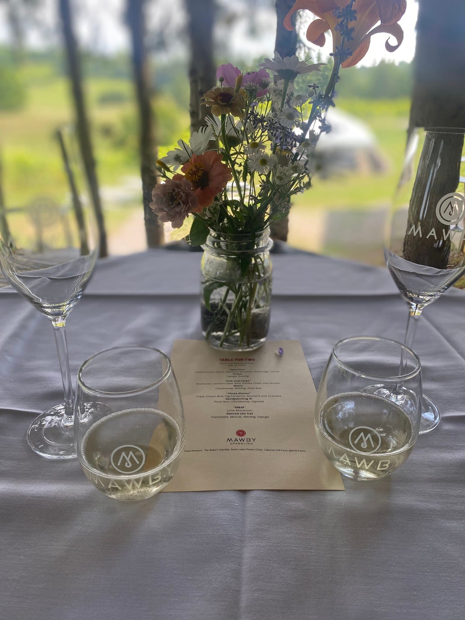 A table setting in a quaint garden on a sunny day.