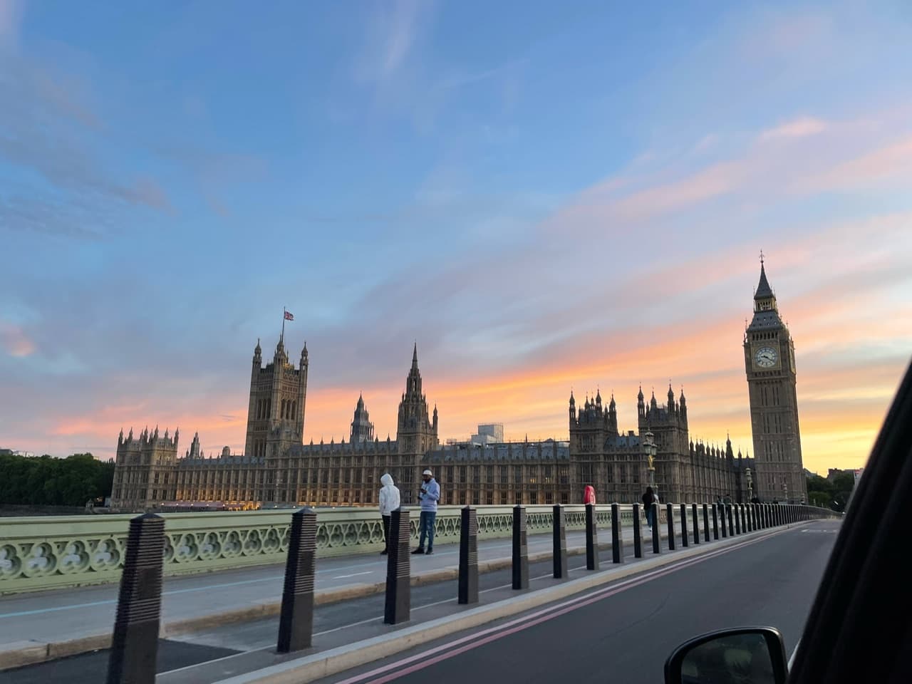 Beautiful view of a street in London at sunset with Big Ben visible in the distance