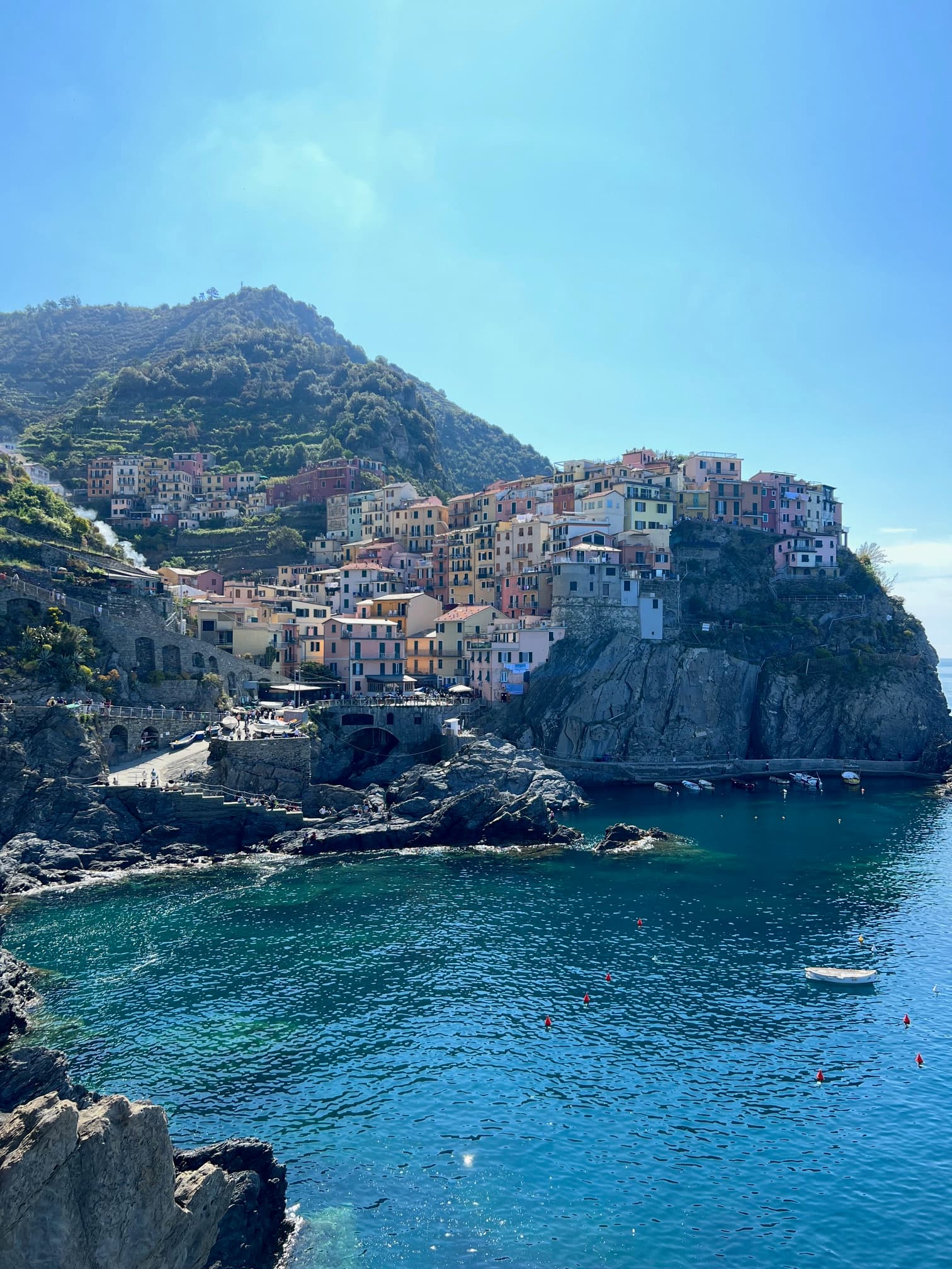 View of a small colorful coastal city on a cliffside