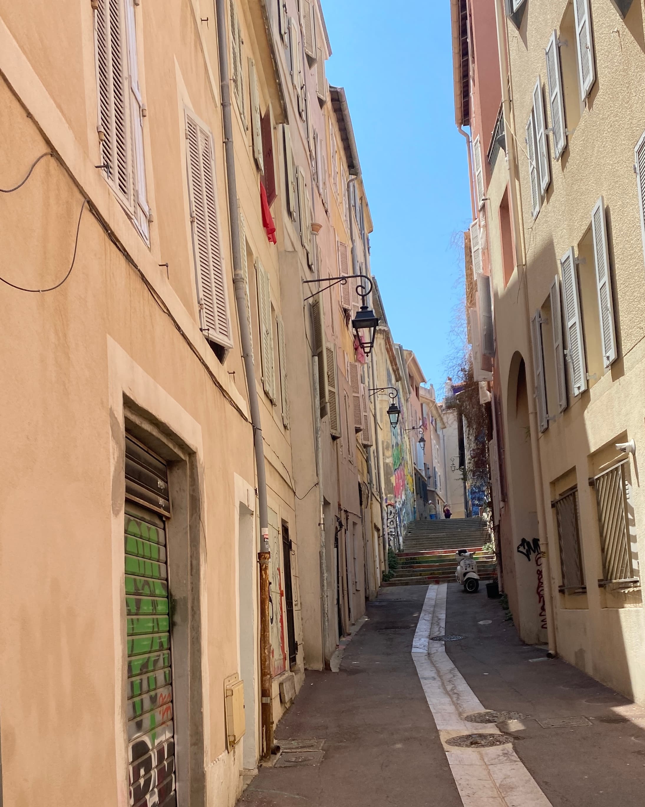 View of a narrow empty street in Marseille on a sunny day