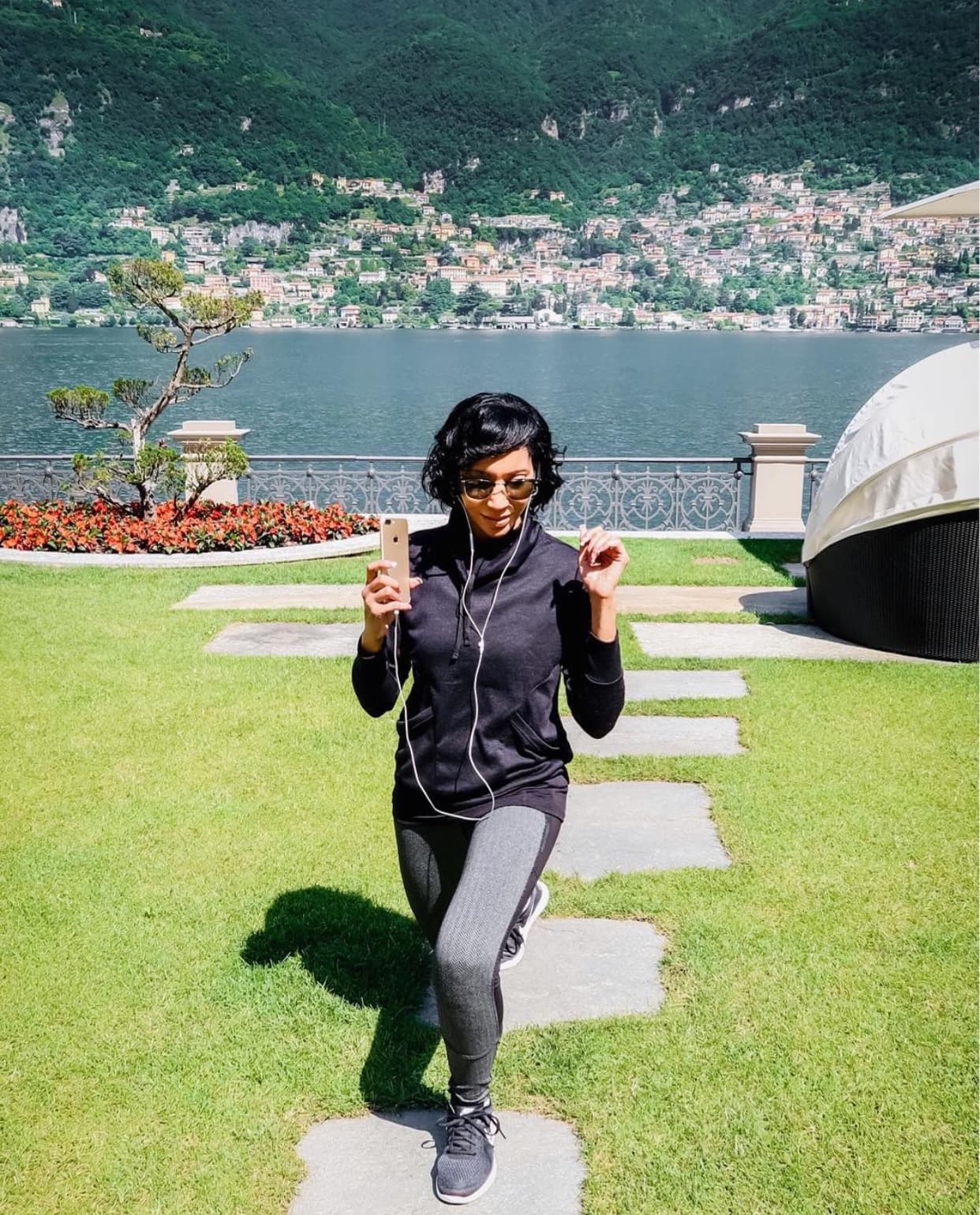Advisor walking on a stone path by a beautiful lake