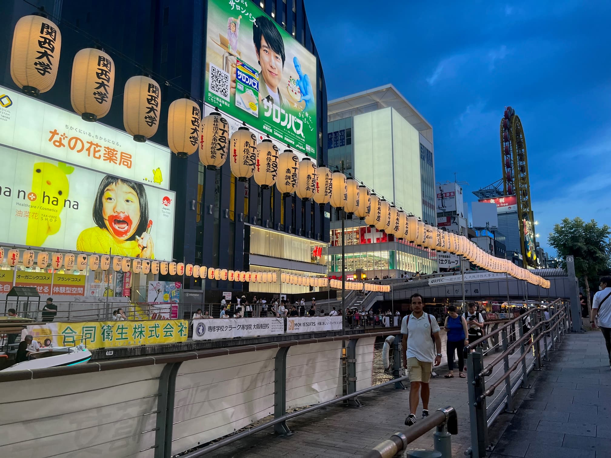 View of posters and billboards lined across a street.