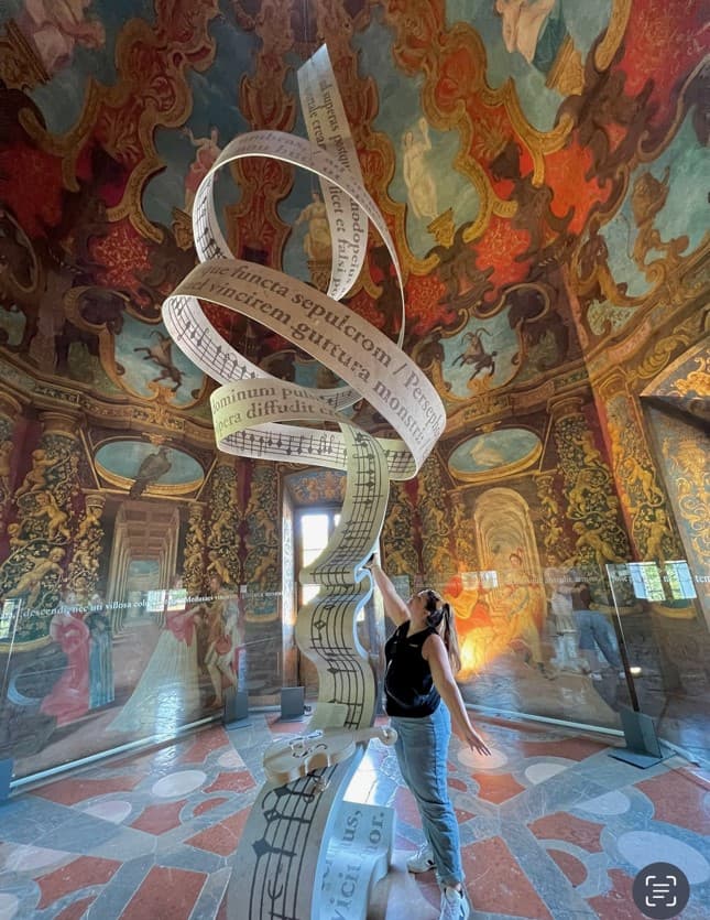 A view of art in a gallery during the day. 